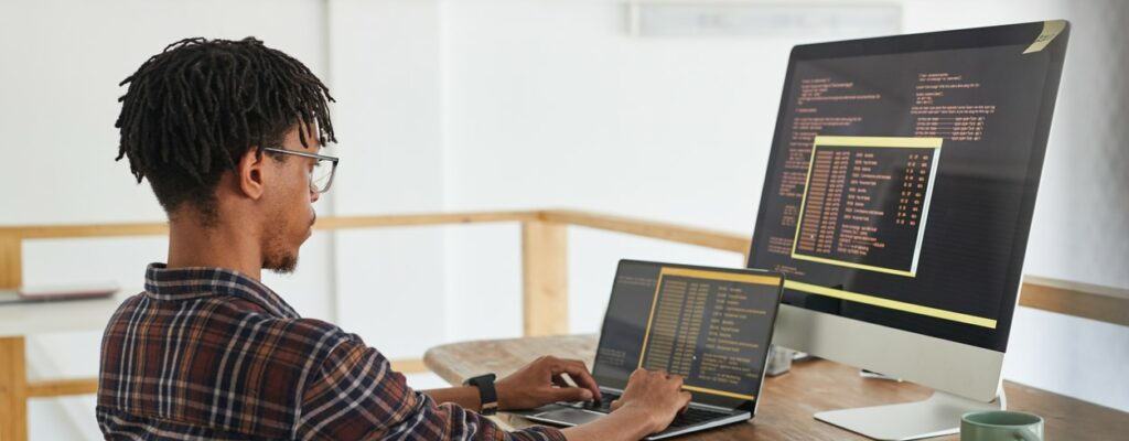 A male employee working on data encryption as part of IT support in West Palm Beach