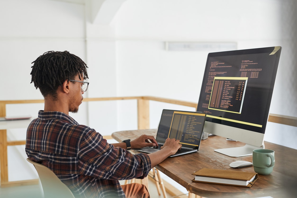 A male employee working on data encryption as part of IT support in West Palm Beach